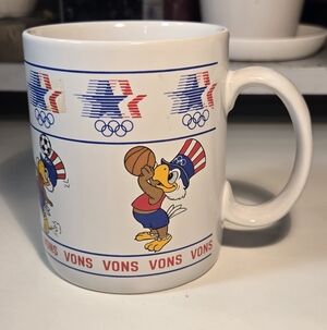 Sam the Olympic Eagle Basketball and Soccer Ceramic Mug by Papel